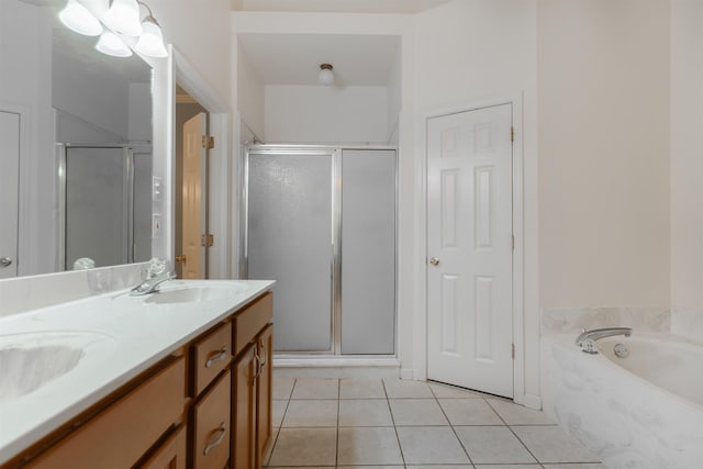 bathroom featuring tile patterned floors, plus walk in shower, and vanity