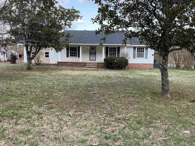 single story home featuring covered porch and a front yard