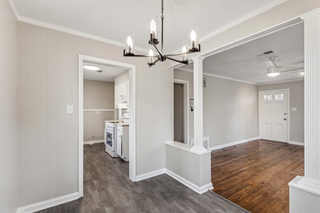 interior space featuring dark hardwood / wood-style flooring, crown molding, and ceiling fan with notable chandelier