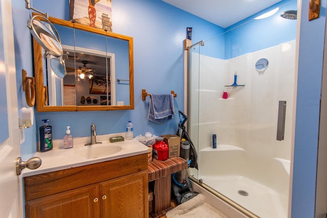 bathroom with walk in shower and vanity