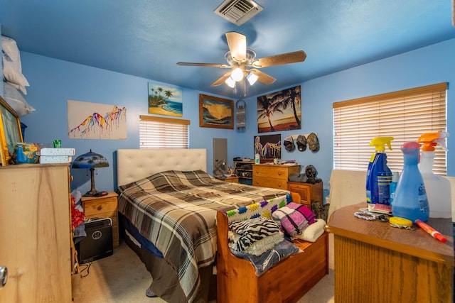 bedroom with light colored carpet and ceiling fan