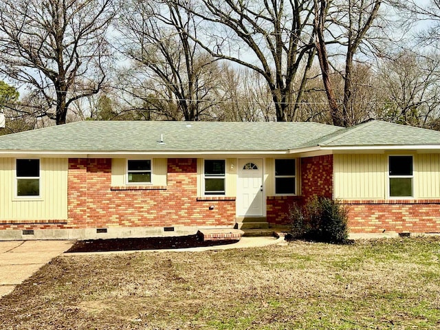 ranch-style home with a front lawn