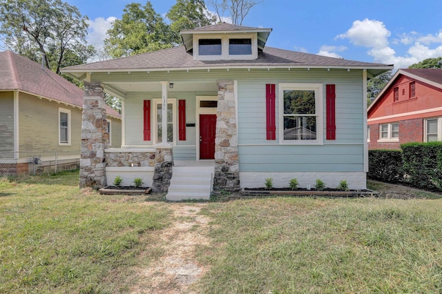 bungalow-style house with a front yard