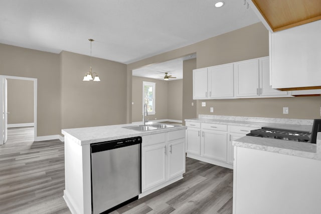 kitchen featuring white cabinetry, sink, an island with sink, and dishwasher