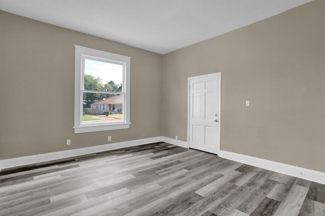 unfurnished room featuring light hardwood / wood-style flooring