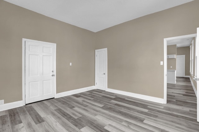 spare room featuring light hardwood / wood-style flooring