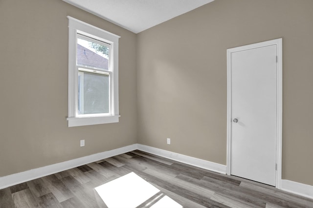 spare room with light wood-type flooring