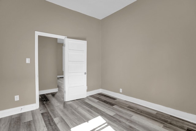 spare room featuring light hardwood / wood-style flooring