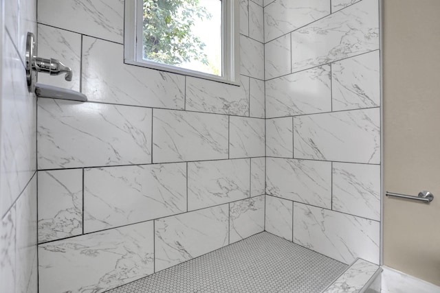 bathroom with a tile shower