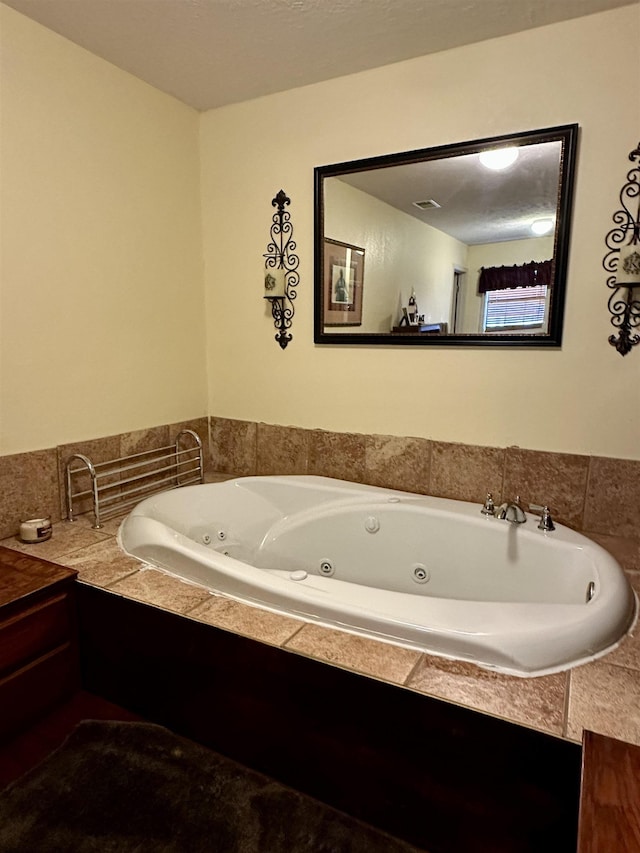 bathroom featuring tiled bath