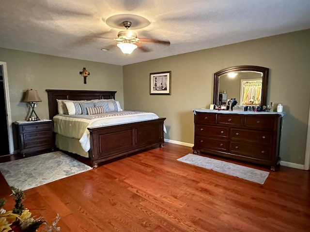 bedroom featuring ceiling fan and hardwood / wood-style floors