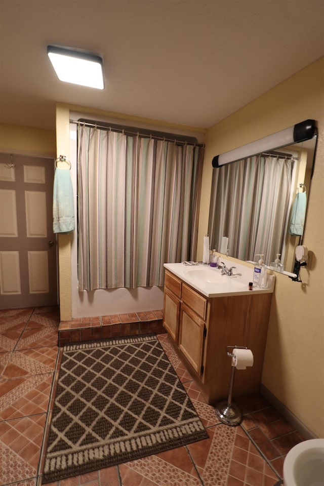 bathroom featuring a shower with curtain, vanity, and tile patterned flooring