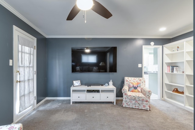 living area featuring light colored carpet, ornamental molding, and ceiling fan