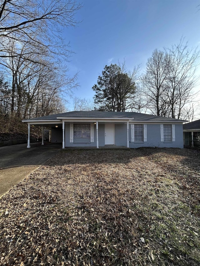 ranch-style home with a carport