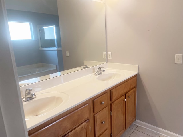 bathroom featuring vanity, a bathing tub, and tile patterned flooring