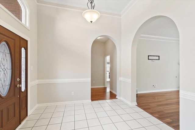 tiled entryway with ornamental molding