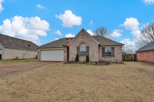 view of front facade featuring a garage and a front lawn