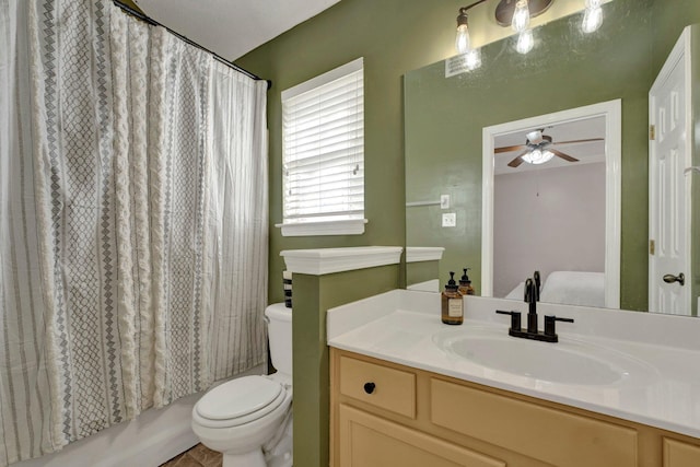 full bathroom with vanity, shower / bath combination with curtain, ceiling fan, and toilet