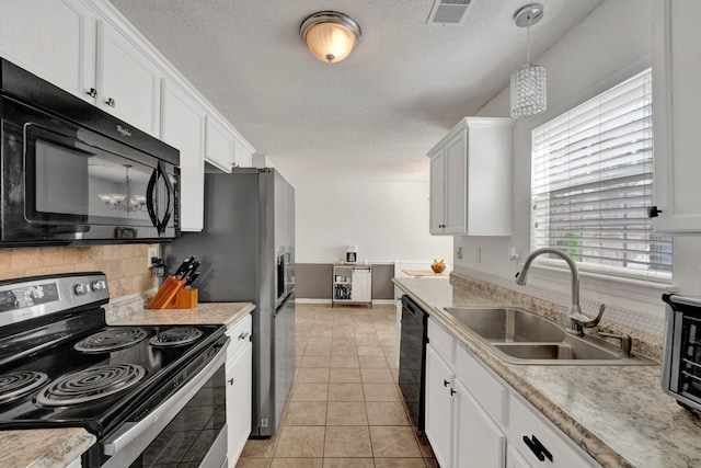 kitchen with light tile patterned flooring, sink, white cabinetry, pendant lighting, and black appliances