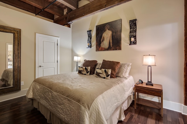 bedroom with beamed ceiling and dark hardwood / wood-style flooring