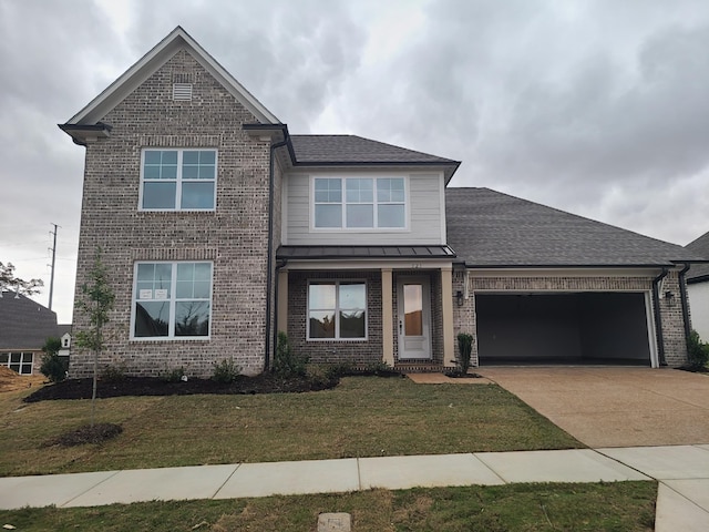 view of front facade with a garage and a front yard