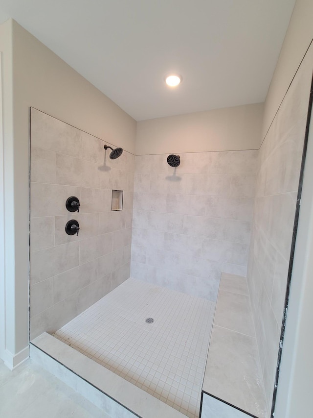 bathroom featuring tiled shower