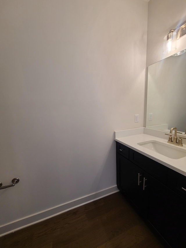 bathroom featuring hardwood / wood-style flooring and vanity