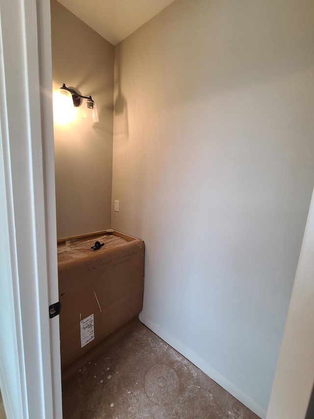 bathroom with concrete flooring