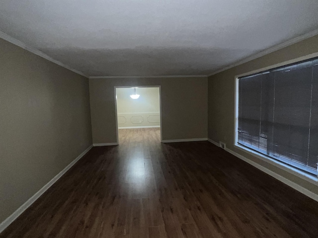 unfurnished room featuring crown molding and dark hardwood / wood-style floors