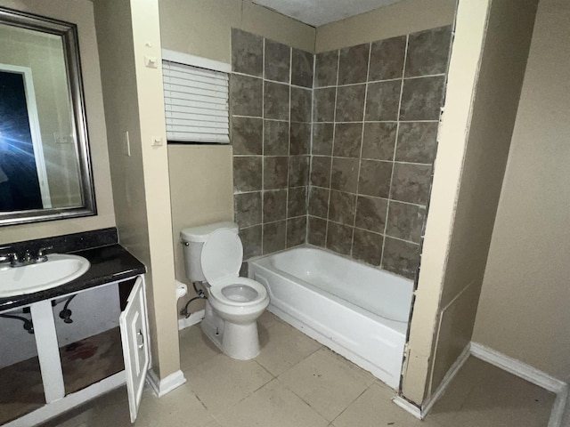 full bathroom with tile patterned flooring, tiled shower / bath, sink, and toilet