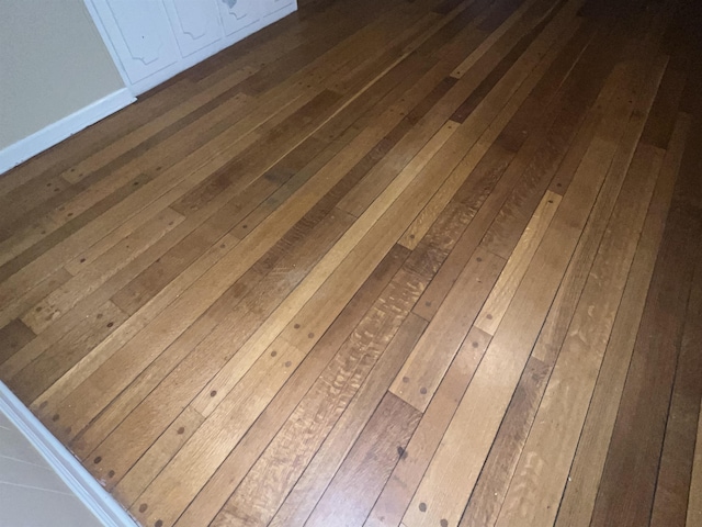 interior details featuring hardwood / wood-style flooring