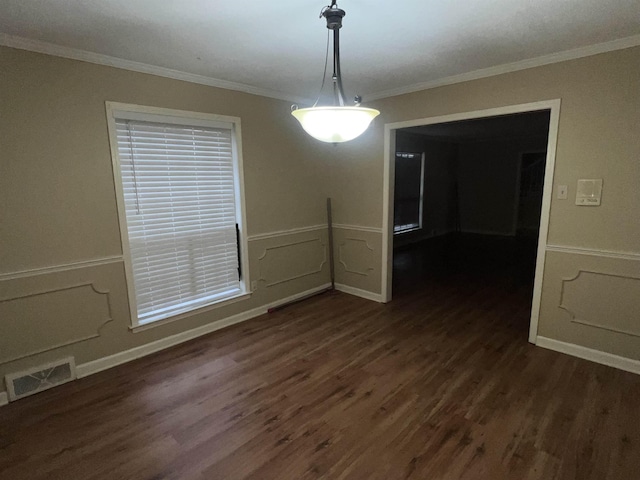 unfurnished dining area with dark hardwood / wood-style flooring and crown molding