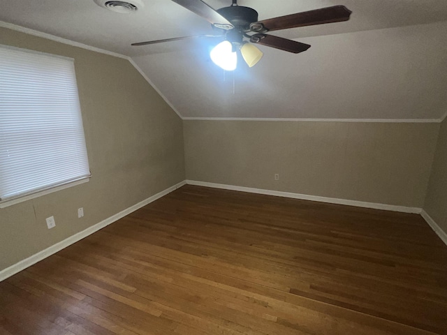 bonus room featuring dark wood-type flooring, ceiling fan, and vaulted ceiling