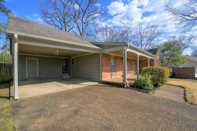 view of front of house featuring a carport and a porch