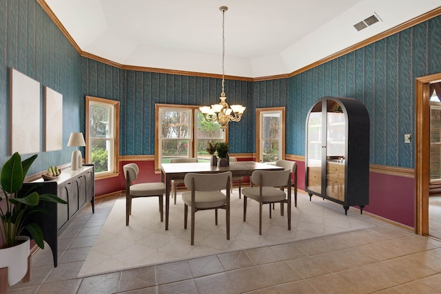 tiled dining room with a chandelier, wallpapered walls, baseboards, and visible vents