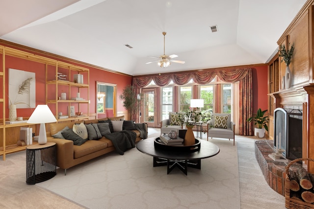living room featuring visible vents, ceiling fan, light colored carpet, and lofted ceiling
