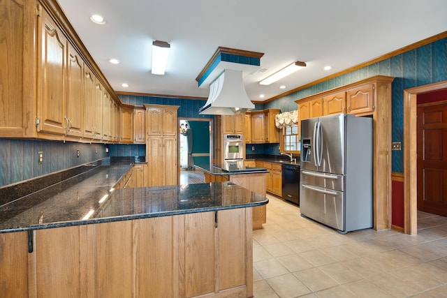 kitchen with recessed lighting, a peninsula, crown molding, dark stone counters, and stainless steel appliances