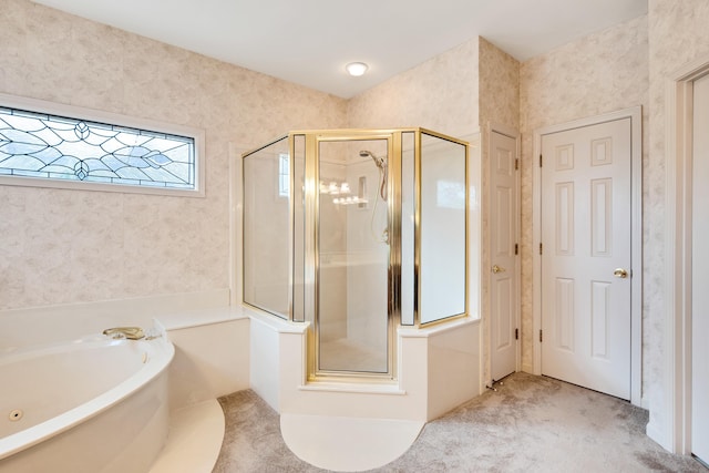 bathroom with a shower stall, a garden tub, and wallpapered walls