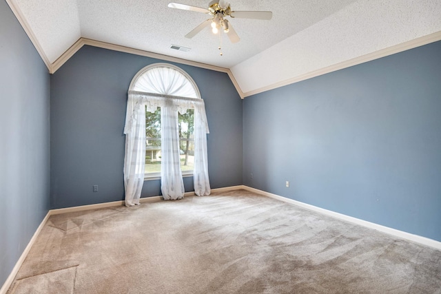 unfurnished room with a healthy amount of sunlight, visible vents, ceiling fan, and carpet floors