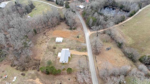 birds eye view of property with a rural view