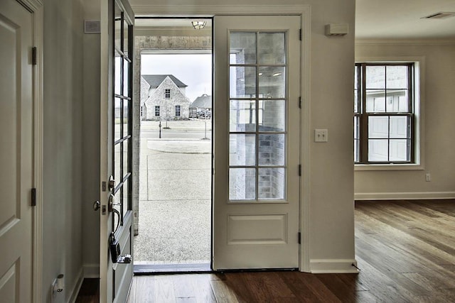 entryway with hardwood / wood-style flooring