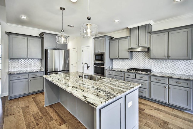 kitchen with stainless steel appliances, sink, and gray cabinetry