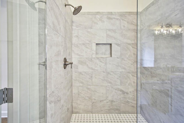 bathroom with a tile shower