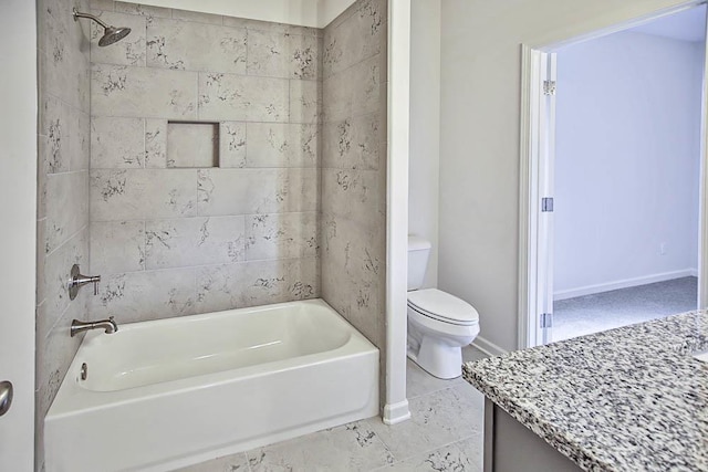 full bathroom with vanity, toilet, and tiled shower / bath