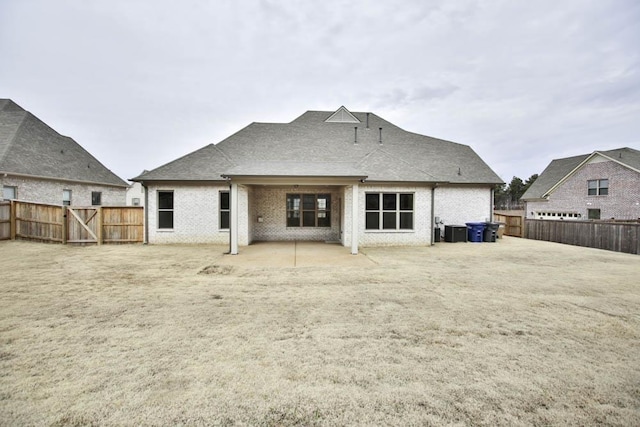 back of house featuring cooling unit and a patio area