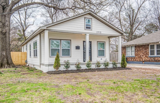 bungalow with a porch and a front yard