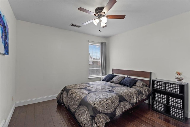 bedroom with ceiling fan and dark hardwood / wood-style flooring