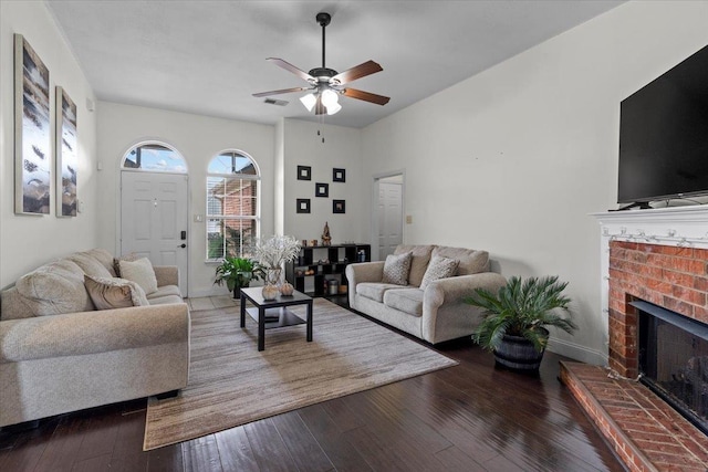 living room with hardwood / wood-style flooring, a fireplace, and ceiling fan