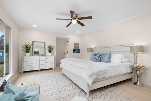 bedroom featuring light hardwood / wood-style floors and ceiling fan