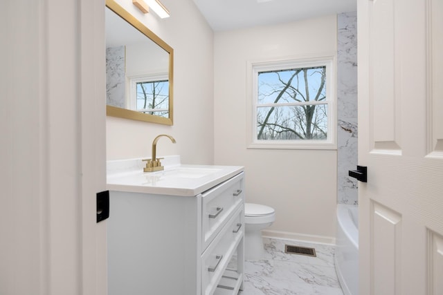 bathroom with vanity and toilet